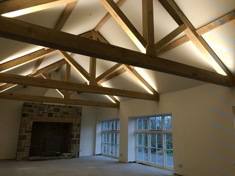 Barn Beam Lighting, Timber Frame Great Room, Barn House Conversion, Barn Conversion Interiors, Exposed Trusses, Exposed Beams Ceiling, Barn Conversions, Open Plan Living And Dining, Oak Framed Buildings