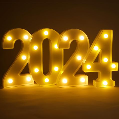 PRICES MAY VARY. SIZE: 8.2 INCH | DAZZLING LED WARM LIGHTS 2024 SIGN : As we usher in the promising graduation year of 2024, why not do it in unparalleled style with our 8.2 Inch, LED 2024 graduation party lights? This stunning decoration piece is designed to add a touch of brilliance and sophistication to your happy graduation decorations 2024, creating a memorable ambiance that will be etched in your guests' memories for years to come. EASY INSTALLATION | BATTERY OPERATED | RADIANT DESIGN : Th Graduates 2024, Graduation Backdrop Ideas 2024, Graduation Marquee Signs, Graduation Class Of 2024, Graduation Neon Sign, Green Graduation Party, Happy New Year Signs, New Year Table, Backyard Graduation Party