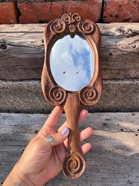 Hand Carved Vintage Wooden Hand Mirror with Rustic Scroll Design by AeteraBoxOfTreasures on Etsy Wooden Hand Mirror, Oval Shaped Mirror, Pocket Mirrors, Shaped Mirror, Mirror Surface, Wood Carving Designs, Wooden Craft, Scroll Work, Carving Art