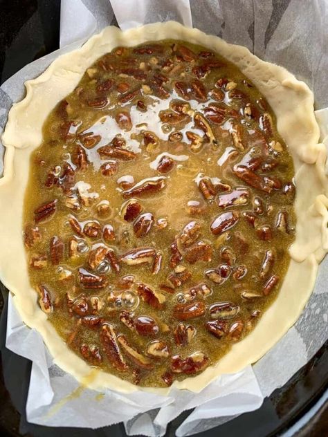 This is an easy recipe for slow cooker pecan pie. The classic dessert is made with candied pecans, an ooey gooey center, and a flaky pie crust. Pecan Crockpot Dessert, Pecan Cobbler Crockpot, Crock Pot Pecan Pie Cobbler, Pecan Pie In Crockpot, Slow Cooker Pecan Pie, Crock Pot Pecan Pie, Crockpot Pecan Pie Cobbler, Crockpot Pie, Crockpot Pecan Pie