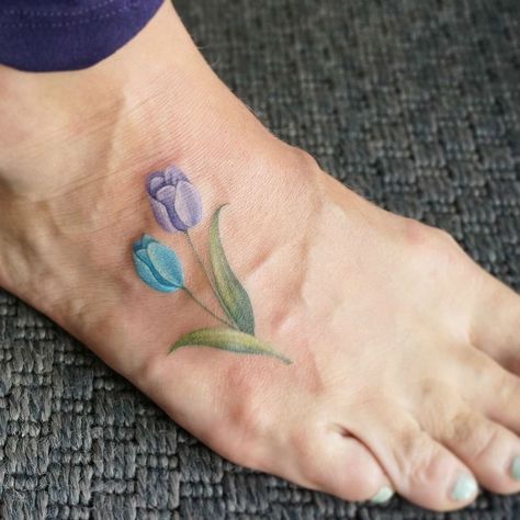 17 Fine Line Pastel Tattoos by G. No Tiny Tulip Tattoo, Pastel Tattoos, Watercolor Flower Tattoo, Tulip Tattoos, Pastel Tattoo, Small Foot Tattoos, Tiny Watercolor, Famous Tattoo Artists, Tulip Tattoo