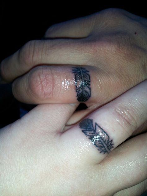 His and hers wedding ring eagle feather tattoos. Hubby and I just got these today. Original concept by: sunnywindsong (me); drawn and tattooed by Jeremy at independent tattoo, Albuquerque, New Mexico. Feather Ring Tattoo, Feather Finger Tattoo, Tattoos His And Hers, Eagle Feather Tattoos, Wedding Ring Tattoos, Tattoo Rings, Independent Tattoo, Marriage Tattoos, Wedding Ring Ideas