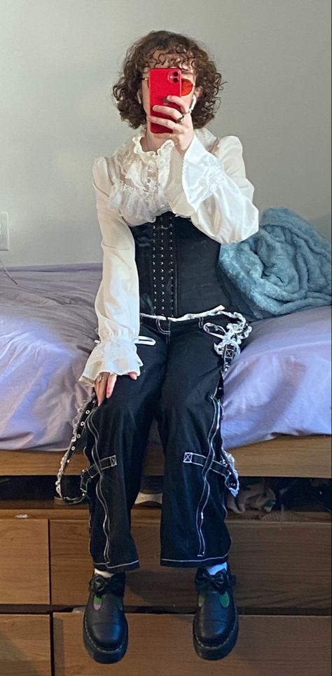 Outfit picture of a thin white person with ear length curly brown hair. They are wearing a white puffy blouse with ruffles, and a black underbust corset. They have black tripp NYC Lolita pants with white lace straps and chains. They are wearing Dr martens Mary janes. They are sitting on a bed and taking a photo in the mirror. They have red glasses. Alt Homecoming Outfit, Formal Alternative Outfit, Formal Punk, Hoco Ideas, Alt Style, Dream Closets, Tripp Nyc, Alt Fashion, Alternative Outfits