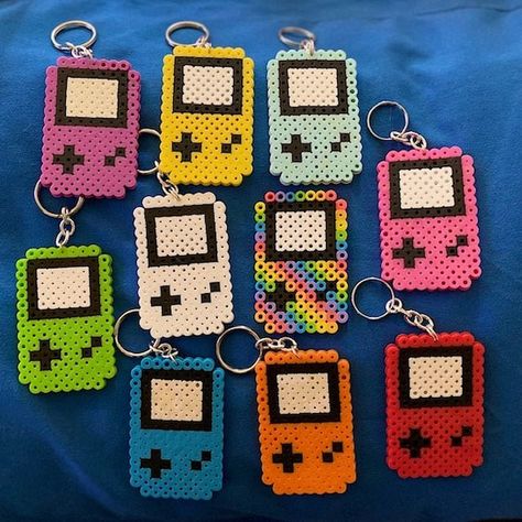 Gameboy Perler Bead Keychain | Etsy Perler Bead Keychain, Perler Bead Designs, Perler Beads Ideas, Melt Beads Patterns, Hamma Beads Ideas, Easy Perler Bead Patterns, Pixel Beads, Melty Bead Patterns, Bead Keychain