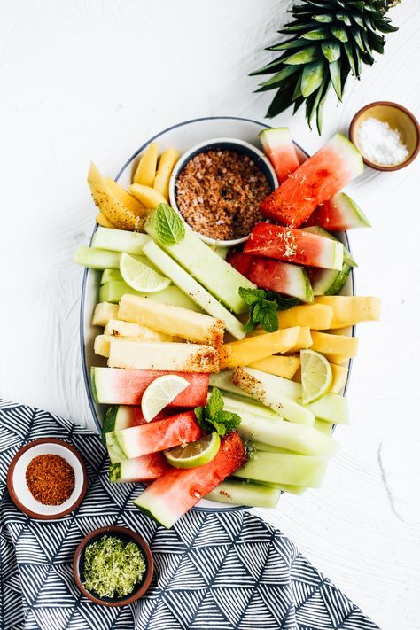 An easy recipe idea for mexican fruit salad. This platter is filled with watermelon, pineapple, mango, and honeydew spears. Along with the fruit spears is a spicy blend of tajin, fresh lime zest and flaky salt. An easy party side dish that is healthy and flavorful! Fruit Spears, Easy Party Side Dishes, Flavorful Snacks, Mexican Fruit Salad, Salad With Chili, Mexican Fruit Salads, Mexican Fruit, Lime Seasoning, Party Side Dishes