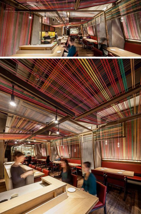 El Equipo Creativo have designed the Pakta Restaurant in Barcelona, Spain, that features an interior with brightly colored ropes. #InteriorDesign #RestaurantDesign #Rope #Ceiling Ceiling Design Restaurant, Bar Ceiling Design, Rustic Restaurant Interior, Colorful Ceiling, Rope Ceiling, Restaurant Ceiling, Ceiling Feature, Modern Restaurant Design, Lake House Interior