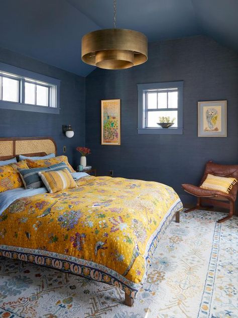 Indigo grass-cloth wallpaper and a matching painted ceiling (Newburyport Blue by Benjamin Moore) make for a moody, dreamy space. “I wanted it to feel like the night sky,” says homeowner Amy Church. What could be more apropos for a bedroom? Plus, the dark surroundings allow this orbit-inspired gold light fixture to shine. Wallpaper Ceiling Bedroom, Fun Paint Ideas, Swinging Couch, Workroom Design, Cool Seating, Newburyport Blue, Massachusetts Home, Northampton Massachusetts, Main Bathroom Ideas