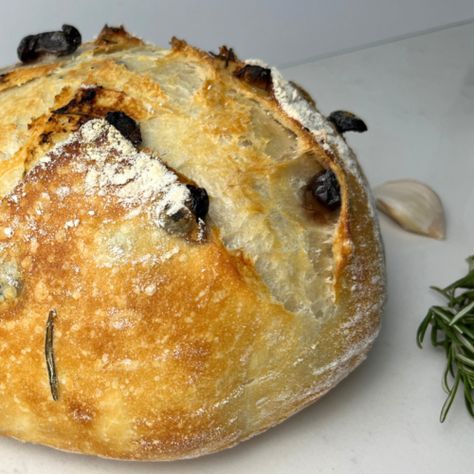 Roasted garlic, rosemary, and Kalamata olive sourdough bread. - Shakan Ranch Olive Sourdough Bread, Bread Roast, High Protein Flour, Roasted Garlic Cloves, Proofing Baskets, Baked Roast, Wild Yeast, Bread Ingredients, Kalamata Olives