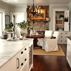 A Winter Farmhouse | The Everyday Home | www.everydayhomeblog.com Benjamin Moore Gray, Brick Fireplace, Counter Tops, White Cabinets, Breakfast Room, Benjamin Moore, Banquette, Beautiful Kitchens, Luxury Interior Design