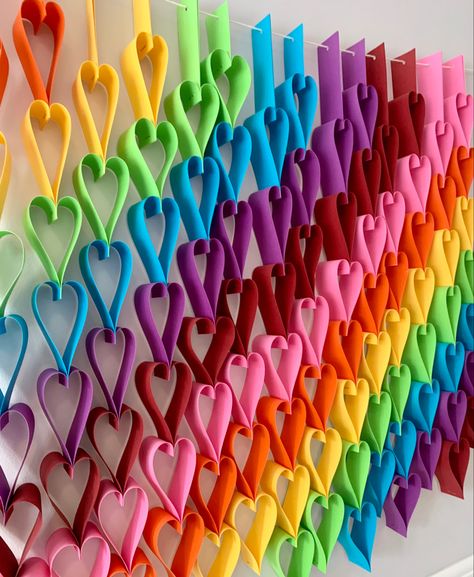 Add some colour to the playroom. Simple rainbow hearts decoration. Kid friendly project. No glue. All you need is paper, a paper cutter (much faster than scissors), and a stapler. Playroom Simple, Paper Room Decor, Showers Ideas, Valentine Art Projects, Valentine Art, Rainbow Garland, Rainbow Wall Decor, Paper Art Sculpture, Paper Chain