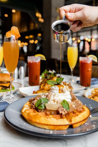 Brunch breakfast restaurant food photography. Mimosa, pancakes, Bloody Mary, syrup pouring