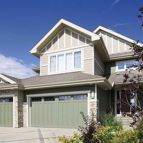 With a beautiful sage green tone, these steel garage doors are a stand-out home feature. | Instagram Green Garage Doors, Green Garage Door, Contemporary Garage Doors, Green Garage, Color Projects, Aluminium Garage Doors, Carriage House Doors, Sectional Garage Doors, House Colour