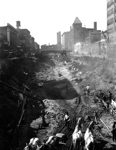 Cincinnati, Ohio, from the collection of the Public Library of Cincinnati and Hamilton County: October, 1920, excavation of the Miami-Erie Canal in Over the Rhine to make way for subway tunnel; Strobridge Lithographing Company in background. Cincinnati Subway, Subway Tunnel, Cincinnati Museum, Board Photography, Hidden City, Erie Canal, History Nerd, Bearded Lady, World Cities