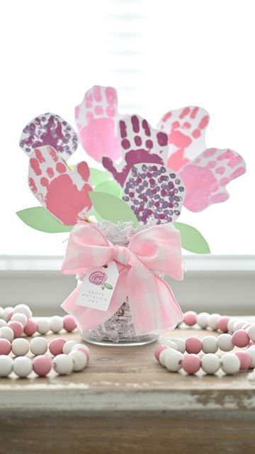 Maggie Bratcher on Instagram: "🌸Mother's Day Handprint Bouquet 🌸 We loved getting to make this craft together! This is a perfect mommy & me project or gift for those special women in your life! Directions: • make handprints on construction paper with paint • use q-tips to make dotted flowers • cut out each handprint/flower • hot glue or tape a pipe cleaner to the back of each flower, add leaves throughout • for multiple kids, you can add a name to each one • add paper filler to vase, then stick each flower in • tie your favorite ribbon and gift tag around the vase • Enjoy or gift! 💕" Handprint Bouquet Of Flowers, Bouquet Of Flowers Craft For Kids, Mothers Day Crafts For Kids Flowers Vase, Handprint Flower Bouquet, Mother’s Day Vase Craft, Handprint Bouquet, Mother’s Day Fingerprint Flower Pot, Dotted Flowers, Handprint Flower