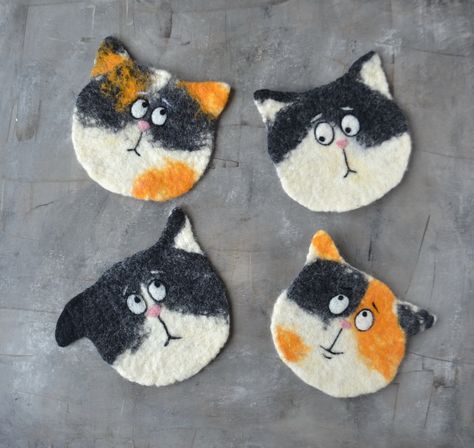 Felted wool funny cat coasters are made from 100% wool.  size 12-13 cm (4.7-5 inch) The price is for one coaster The color and coat pattern of the cat can be changed to  the one  of your pet or just the one you like. Handmade felted drink coasters are soft and light, absorb moisture well and protect your table from scratches, condensation or liquid drops. Handmade felted drink coasters are soft and light, absorb moisture well and protect your table from scratches, condensation or liquid drops. Wool coasters are easy to wash in slightly warm water, after washing they can be wrung out with a towel and laid to dry on a flat surface. These fun coasters will look cute in your kitchen and bring smiles to you and your friends.  These cat coaster set is unique, cute, fun gift for housewarming. Small Picnic, Wool Felt Coasters, Wool Coasters, Cat Snacks, Cool Coasters, Felt Coasters, Cat Coasters, Fabric Gift Wrap, Wet Felt