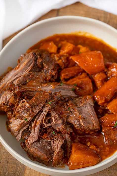 Slow Cooker Caribbean Pot Roast is a perfectly tender chuck roast full of tropical spices with sweet potatoes and root vegetables. #slowcookerpotroast #caribbeanpotroast #crockpottpotroast #slowcookerrecpies #crockpotrecipes #dinnerthendessert Recipe For Chuck Roast, Chuck Roast In Crockpot, Roast In Crockpot, Tender Chuck Roast, Crock Pot Sweet Potatoes, Roast Beef Recipe, Slow Cooker Pot Roast Recipes, Crockpot Roast Recipes, Pot Roast Crock Pot Recipes