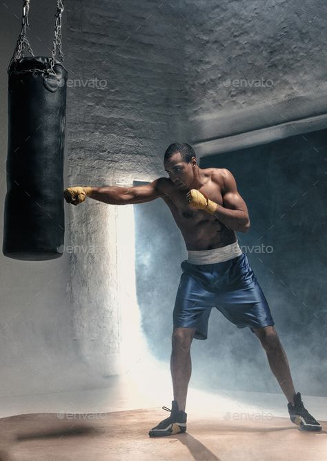 Hand of boxer and punching bag over black background. Strength, attack and motion concept. Fit african american model in movement. Afro muscular athlete in sport uniform. Sporty man during boxing e... Punching Bag Workout, Male Fitness Photography, Home Boxing Workout, Boxing Punches, Boxing Punching Bag, Boxing Bag, Training Boxing, Fitness Photoshoot, Sports Aesthetic