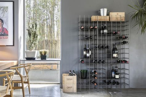 Metrica winery is a metal bottle holder with a simple structure marked by iron rods fixed at different intervals where bottles and objects complete the shape writing new compositions from time to time. Structure in burnished metal with bronze tinted glass shelves. #winerack #winestorage #winebar #winelovers #furnituredesign #bottleholder #interiordecor #interiorideas #metalrack #architecture #interiordesign #storage Standing Wine Rack, Wine Rack Design, Wine Rack Storage, Wall Mounted Wine Rack, Wine Shelves, Metal Bottle, Metal Bottles, Metal Floor, Bottle Rack