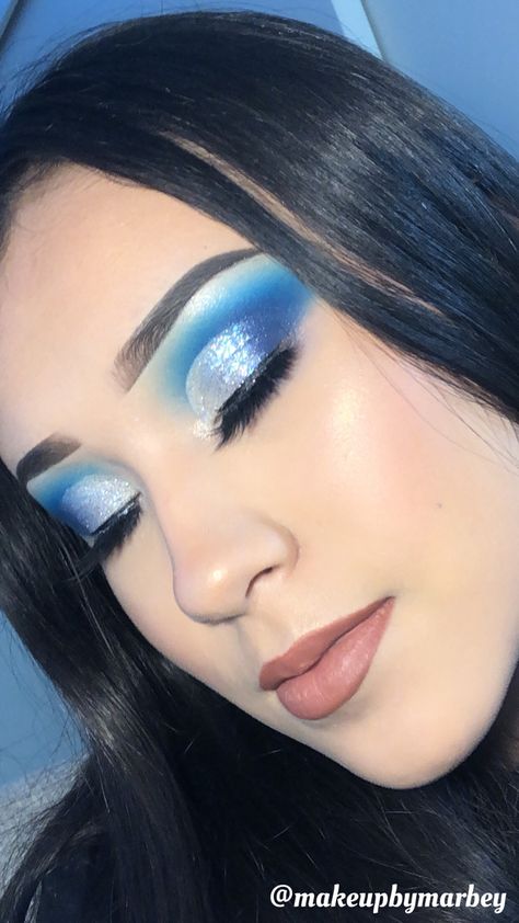 Blue And Glitter Makeup, Light Blue Makeup With Gems, Blue White And Silver Eye Makeup, Blue Festival Makeup Glitter, Blue Eyeshadow With Glitter, Light Blue And Silver Eye Makeup, Blue Eyeshadow Looks Hooded Eyes, Blue Christmas Eyeshadow, Blue Winter Makeup Looks