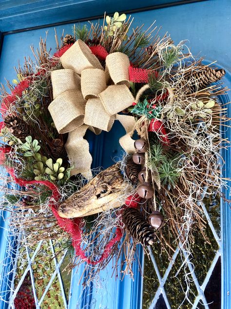 I made this wreath with a real gator head. This year we're having a Cajun Christmas. Mom's Cajun, so she's going to read the Cajun Night Before Christmas book to our 17 grandkids on Christmas Eve. We're having gumbo, boudin dip, and gator sausage. Mom's turning 88 in a few days. Merry Christmas Sha!🐊🎅🏼 Boudin Dip, Cajun Night Before Christmas, Louisiana Decor, Cajun Christmas, Night Before Christmas, Christmas Book, Gumbo, Christmas House, Christmas Books