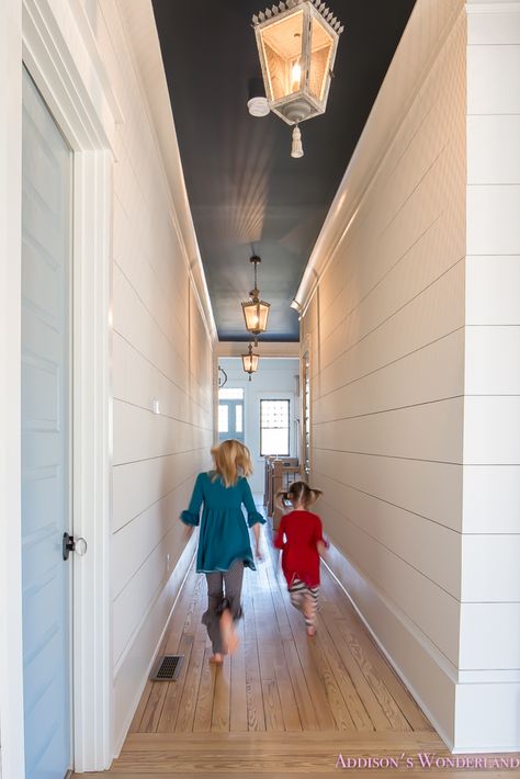 Our 1905 Restoration Home Tour Reveal...    hallway-white-walls-shiplap-black-ceiling-alabaster-inkwell-lantern-chateau-blue-door-stardew-uncertain-grey-whitewashed-hardwood-flooring Shiplap Hallway, Baseboard Styles, Hallway Ceiling, Dark Ceiling, Mobil Home, Black Ceiling, Blue Door, Ship Lap Walls, Hallway Decorating