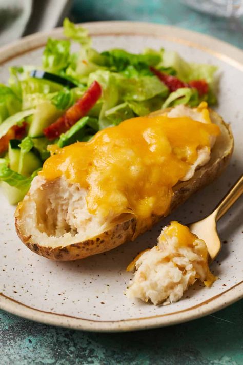 Tuna Baked Potatoes (aka Tuna Stuffed Potatoes) are like if you married a tuna melt with twice-baked potatoes. Baked potato skins are stuffed with a creamy potato and tuna filling topped with melty shredded cheddar cheese. Tuna Baked Potato, Tuna Potato Bake, Tuna Potato, Tuna Bake, Baked Potato Skins, Potatoes Baked, Stuffed Potatoes, Tuna Melt, Shredded Cheddar Cheese