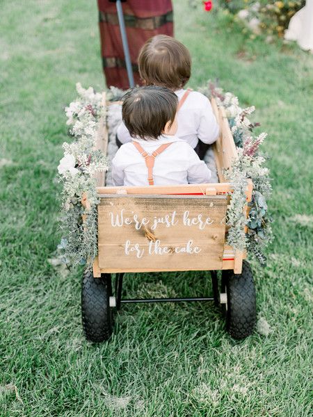 Wedding | Ring Bearer | Wedding Party | Wagon | Cute | Adorable | Ring Bearers | Ceremony | I Do | Bride | Groom | Florals | Couple | We're Just Here For The Cake | Newlyweds | Cute Couple | Couple Goals | Photography | Venue | Rustic | Outdoor | Reception | She said Yes | Neutrals | Greenery | Romantic | Petals | Dress | Guests | Ring Bearer Wagon, Wedding Wagon, Wedding Rings Couple, Wagon For Wedding, Petals Dress, Goals Photography, Wedding Planner Business Card, Ideas Wedding Party, Wedding Budget Planner