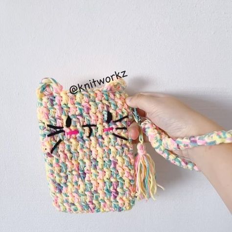 Knitworkz on Instagram: "[Free pattern] Cat Handphone Pouch by @knitworkz.

YouTube tutorial is available too.

The pattern is FREE, enjoy crocheting~ Please don’t forget to tag me so I can see and share your work!

Full video tutorial available on  my YouTube channel.

#crochet #crochetlove
#crocheter #crochetaddict #crocheted
#crochetinspiration #crocheting #crochetlover
#lovecrochet #crochetpattern #crochetdeco #freecrochetpatterns #freecrochetpattern
#crochetpattern #amigurumifreepattern #amigurumipatterns #amigurumilove #crochetinspiration #crochetcat #amigurumimario#crochetkeychain #freepattern #freepatterns #patterns #free_tutorial #crochetpouch" Free Cat Loaf Crochet Pattern, Crochet Loaf Cats Pattern, Cat Bag Crochet Free Pattern, Cat Pouch Crochet, Cakey Cat Crochet Pattern, Pattern Cat, Crochet Pouch, Crochet Lovers, Youtube Tutorials