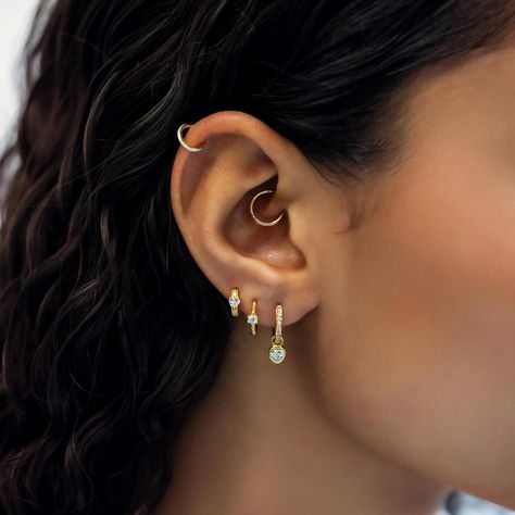 Most secure huggie earring has a hinge that is hidden when closed. Great for cartilage helix, tragus, rook, daith, septum and upper lobe piercings. 14K Gold Hypoallergenic, lead and nickel free Thickness 1mm, 18 gauge Endless Hoop Closure #JS010-G Hoops All The Way Up Ear, Cute Piercing Combinations, Heart Shaped Daith Piercing, Detached Earlobe Piercings, Daith Piercing Hoop, Dainty Daith Piercing, Ear Piercings Upper Lobe, Gold Daith Piercing, Helix And Daith Piercing