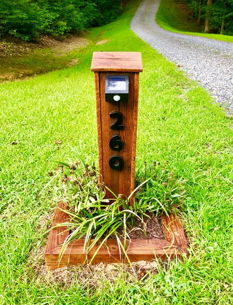 House Number Post. Pallet wood project with motion sensor solar light. Wood Address Sign Outdoor Rustic, Address Sign With Solar Light, Solar Light Post Ideas, House Number Post Ideas, Diy Solar Light Post, Driveway Posts With Lights, Pallet Address Sign, House Number Post, Diy Yard Furniture