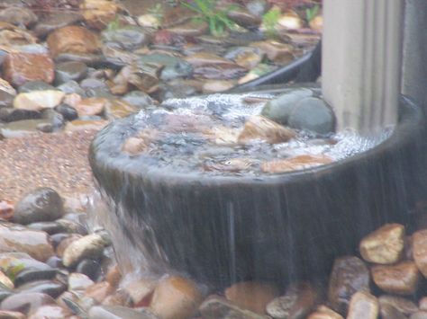 rain downspout catch basin in action during a downpour Downspout Waterfall, Dragon Downspout, River Rock Downspout Run Off, Rain Chain Basin Ideas, Drain Chain Downspout Ideas, Downspout Drainage Ideas, Down Spout, Diverting Water From Downspout, Downspout Drainage