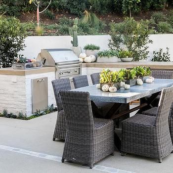 Dark Gray Granite Outdoor Dining Table with Gray Wicker Chairs Granite Outdoor Table, Painted Brick Outdoor Kitchen, Outdoor Bbq Island, Concrete Outdoor Kitchen, Outdoor Kitchen Countertops, Gray Granite, Concrete Countertop, Outdoor Kitchen Decor, Outdoor Kitchen Bars