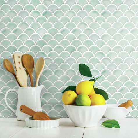 "Buy the RoomMates Aqua Scallop Peel & Stick Backsplash StickTiles® at Michaels. com. StickTiles have a 3D glossy finish giving you the look and feel of genuine designer tiles. Soft seafoam tones marry with a stylized arch design reminiscent of a scallop shell in RoomMates’ Aqua Scallop peel and stick StickTiles. Hints of gray and beige peek through the green to blue watercolors making this the perfect backsplash for any home by the sea or that would like to emulate the seashore. StickTiles have Aqua Palette, Scallop Tiles, Room Mates, Roommate Decor, Stick Tile Backsplash, Peel Stick Backsplash, Fish Scale Tile, Peel And Stick Backsplash, Stick Backsplash