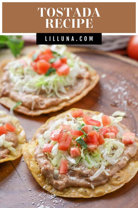 These open-face tostadas are topped with all of your favorite Mexican ingredients! These tasty tostadas are a frequent meal in this house. #tostadas #tostadarecipe #openfacetostadas #mexicanfood #tacos Mexican Tostadas, Homemade Spanish Rice, Easy Mexican Dishes, Mexican Ingredients, Farmhouse Recipes, Tostada Recipes, Refried Beans Recipe, Taco Spaghetti, Lil Luna