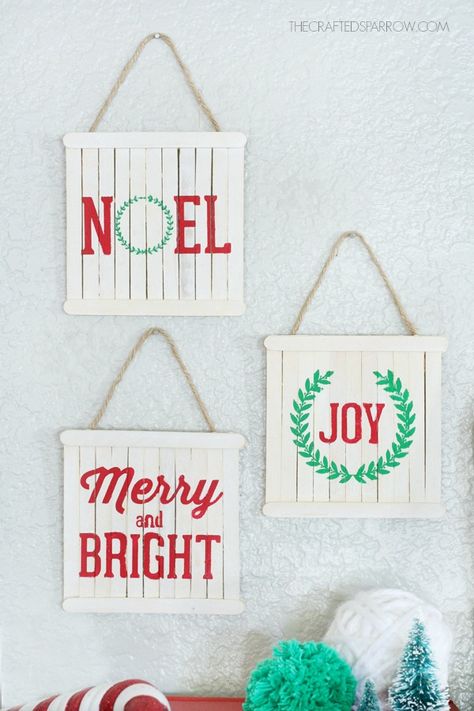 Create these signs using popsicle sticks as a base. Once painted, top them on your tree or hang them in rows along your walls. Get the tutorial at Crafted Sparrow. Popsicle Stick Ornaments, Paint Stick Crafts, Diy Popsicle, Popsicle Crafts, Popsicle Stick Crafts, Easy Christmas Crafts, Popsicle Sticks, Diy Holiday, Xmas Crafts