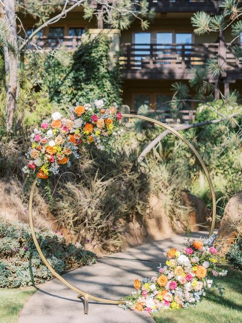 Circular Floral Arrangements, Garden Ceremony Wedding, Ranunculus Orange, Circular Wedding Arch, Tropical Disco, Circular Arch, Wisteria Garland, Wedding Arch Floral, Golden Arch