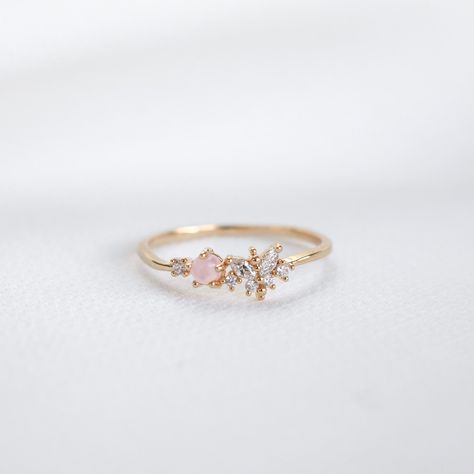 Our feminine Ria Ring features a butterfly design embellished with a pink stone and circle cut crystals on a dainty band.  Main material: Rose Gold, Rhodium, 16k Gold Plated on Brass, Cubic Zirconia Tarnish-resistant protective coating Need some jewelry inspiration? Follow us on Instagram  @statementGrey Promise Rings Danty, Delicate Butterfly Ring For Weddings, Feminine Adjustable Wedding Rings, Cute Rose Gold Wedding Rings, Delicate Butterfly Ring For Anniversary, Dainty Rose Gold Butterfly Ring For Wedding, Delicate Adjustable Butterfly Promise Ring, Dainty Butterfly Ring For Wedding, Dainty Adjustable Butterfly Promise Ring