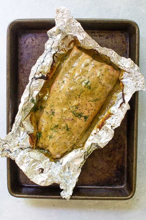 This easy honey mustard baked salmon takes about five minutes to prep and less than 15 minutes to cook. The flavorful honey mustard sauce is made with simple pantry ingredients along with some fresh dill. Just mix up the sauce, pour it over the salmon and bake it for an easy weeknight dinner. #dinner #seafood #salmon #honey #mustard #cooking #recipes #dill Salmon Honey Mustard, Salmon Honey, Honey Mustard Salmon Recipes, Easy Honey Mustard, Dinner Seafood, Honey Mustard Recipes, Honey Mustard Salmon, 20 Minute Dinners, Fish Recipes Baked