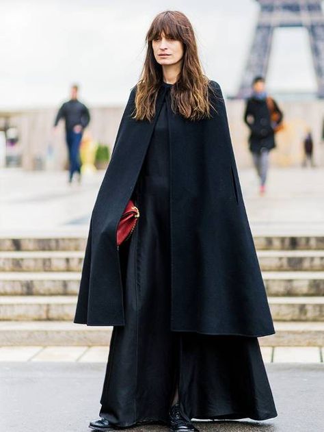 How to Wear a Cape: It's Not as Complicated as You Think | Who What Wear UK Black Cape Outfit, Capes Fashion, Svarta Outfits, Modest Black Dress, Cape Outfit, Best Winter Coats, Outerwear Trends, Black Cape, Cape Style