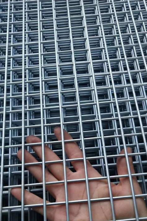 Welded Wire Mesh can be divided into welded mesh rolls and welded wire mesh panels. The welded wire mesh rolls are widely used for garden fencing, plaster mesh. Welded Wire Mesh panel has thicker wire diameter and larger opening sizes for high security applications, such as prison fencing, factory fencing and other site security fencing. Wire Mesh Fence Ideas, Welded Wire Mesh Fence, Mesh Fence Ideas, Wire Fence Ideas, Wire Fence Panels, Hog Wire Fence, Metal Mesh Screen, Security Fencing, Welded Wire Fence