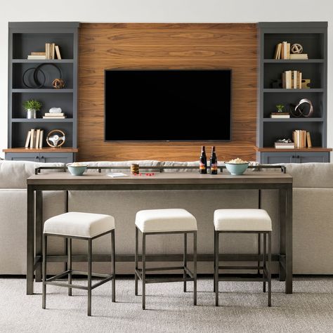 The Mitchell Console Table and Stools has the charm of rustic design mixed with the art of accessibility. Place behind the sofa and watch the game with friends and family! A space-friendly design that is versatile and comfortable, all while looking spectacular!  100% Olefin, Cleaning Code: WS Poplar Veneers and Solids High Table Behind Couch, Bar Table Behind Sofa, Bar Seating Behind Sofa, Stools Behind Couch, Sofa Table Bar Behind Couch, Sofa Table Behind Couch With Stools Modern, Sofa Console With Stools, Sofa Desk Behind Couch, Home Bar Tables