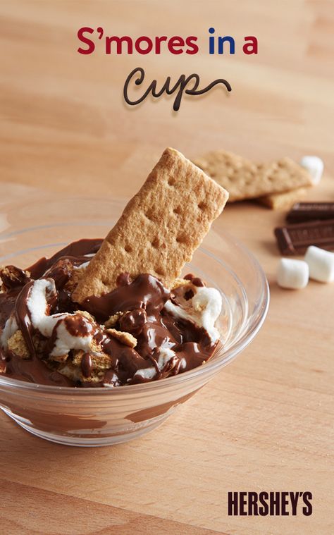 Think there’s only one way to bake up a S’more? Think again! Take a look at these delicious deconstructed HERSHEY’S S’mores In A Cup; just as delicious as the original but with half the mess. All you have to do is break a graham cracker and HERSHEY’S Milk Chocolate Bar into pieces and place them in a microwave bowl or cup to warm up for 15 seconds on high. Add miniature marshmallows and boom: S'mores any time and any place Smores Cups, Dessert In A Mug, Microwave Dessert, Tailgate Snacks, Sweet Appetizer, Biscuits Graham, Smore Recipes, Sweet Dips, Marshmallows