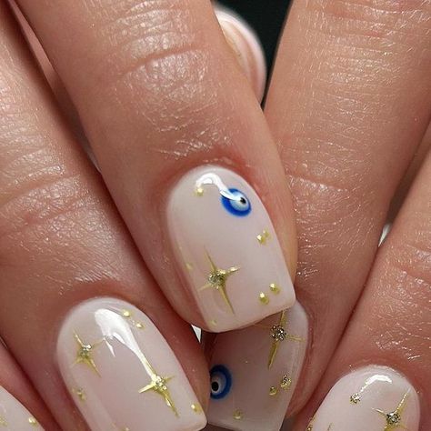 Shelley Graham on Instagram: "Chrome stars and evil eyes, nails to bring you good luck. Products from @the_gelbottle_inc Biab Nu05 base Electric blue Double Denim Daisy @worldofglitterltd (Cosmic) gold chrome Original inspo unknown, client pic. #thegelbottleinc #thegelbottle #evileye #evileyenails #greeknails #holidaynails #starnails #squarenails #shortnails #shortnailsdesign #nailart #chromenailart #chromenails #biabnu05 #buildernails #nailitdaily #neutralnails #worldofglitter #gelnail Short Simple Holiday Nails, Greek Nails, Greece Nails, Ball Nails, Cosmic Nails, Nail Vibes, Biab Nails, Eyes Nails, Bookstagram Ideas