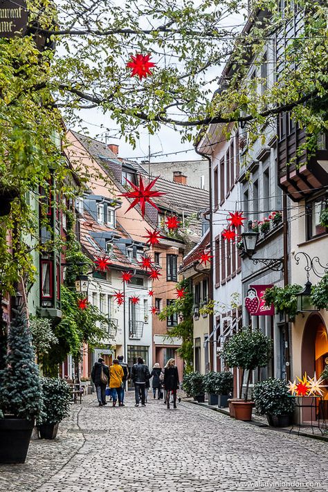 This is a pretty street in Freiburg, Germany. This guide to the best places to visit in Germany in winter will help you with your Germany travel itinerary. From Stuttgart to Feriburg and Baden-Baden, it has great German Christmas market ideas, spas, and more. #germany #wintertravel #winter #freiburg Freiburg Christmas Market, Germany Travel Winter, Germany At Christmas, Germany In December, Stuttgart Christmas Market, Winter In Germany, Visiting Germany, Christmas Germany, Germany In Winter