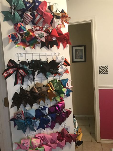 Cheer bow organizer Hooks from the dollar store Cheer Bow Organization, Cheer Bow Organizer, Cheer Bow Holder Diy, Cheer Bow Storage, Cheer Bow Display, Cheer Bow Ideas, Diy Ribbon Holder, Bow Organization, Cheer Wall