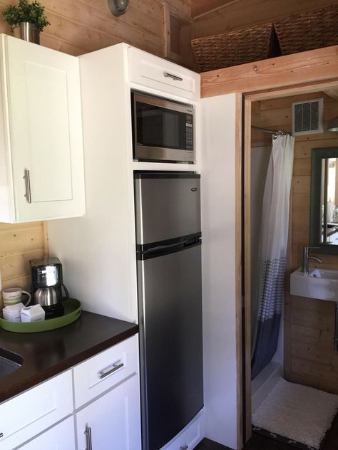 270 Sq. Ft. La Mirada Tiny House on Wheels For Sale Tiny House Refrigerator Small Spaces, Tiny House Refrigerator, Apartment Size Fridge, Tiny House Fridge, 200 Sq Ft Tiny House Interior, Microwave On Top Of Fridge, Farmhouse Kitchen Cabinet Decor, Tiny House Kitchen Storage, Tiny Fridge