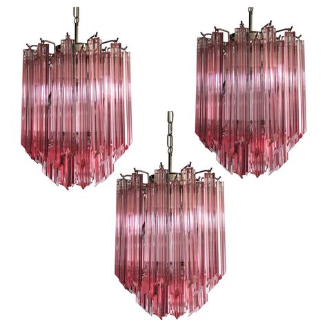 Trio Murano chandelier made by 47 Murano pink crystal prism "quadriedri" in a nickel metal frame. The glass are in 2 different dimension: 28 bigger and 19 smaller. Period: Late 20th century Dimensions: 43.30 inches height (110 cm) with chain; 19.70 inches height (50 cm) without chain; 12.6 inches diameter (32 cm) Dimension glasses: the bigger are 11 inches (28 cm) height x 1.20 inches (3 cm) length; the smaller are 3.95 inches (10 cm) height x 1.20 inches (3 cm) length Light bulbs: 6 lights bulb Pink Crystal Chandelier, Glass Chandeliers, Murano Chandelier, Nickel Metal, Murano Glass Chandelier, Hallway Lighting, Crystal Prisms, Beautiful Chandelier, Modern Glass