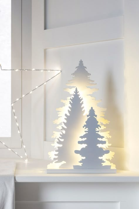 Channel the natural beauty of Aspen's forests with our magical wooden light Christmas decoration. Three layered cut out detail conifer trees stand tall, backlit with a wonderful warm white glow. These pretty pieces sit pretty on windowsills and mantelpieces alike. Forest Items, Christmas Window Lights, Indoor Christmas Lights, Silhouette Christmas, Wooden Light, Plastic Eggs, Decorating With Christmas Lights, Indoor Christmas, Christmas Window