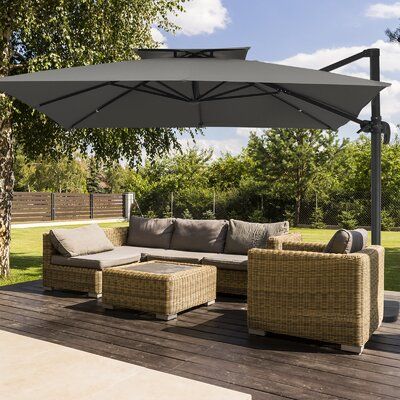 A shady retreat within walking distance from your back door? Get ready to build a patio that's ready to party with our cantilever umbrella! Stylish as it is, this umbrella is can stand up to natural damage that comes along with sunlight and rain. Caution and care: This umbrella can not stand alone. It must be secured with a weighted base (sold separately) or other weights (sandbags or bricks). We highly recommend a base (SKU: W007398554) for this heavy-duty umbrella. Fabric Color: Gray | Arlmont Build A Patio, Building A Patio, Cantilever Patio Umbrella, Offset Patio Umbrella, Offset Umbrella, Garden Umbrella, Canopy Design, Cantilever Umbrella, Back Door