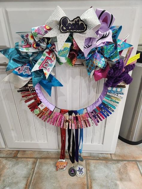 Cheer Medal Display, Cheer Ribbon Display, Cheer Trophy Display Ideas, Cheer Ring Display, Cheerleading Medal Display Ideas, Cheer Wall Ideas, Cheer Bow Storage Ideas, Cheer Award Display Ideas, Cheer Bow Display Ideas